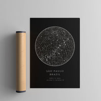 black circle star map print next to a poster tube