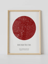 A framed custom star map poster featuring a specific date and location, customized with the quote "Born under these stars"