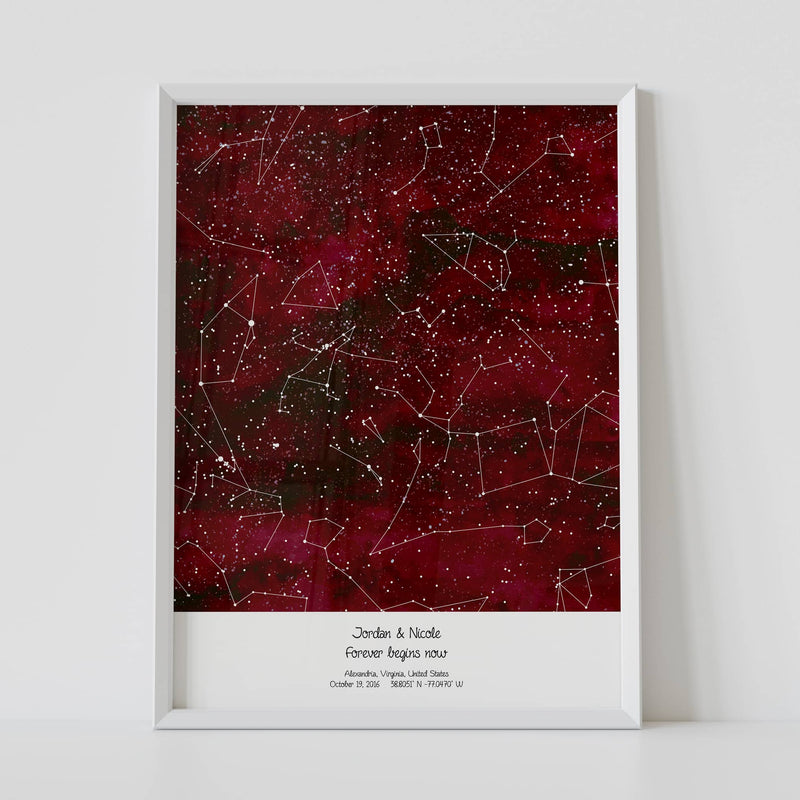 A framed red constellation map poster, with a personalized quote "Forever begins here"