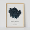 A framed blue constellation map poster, with a personalized quote "The day our stars aligned"