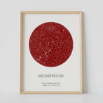 A framed red circle constellation map poster, with a personalized quote "Born under these stars"