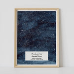 A framed blue constellation map poster, with a personalized quote "The day our lives changed forever"