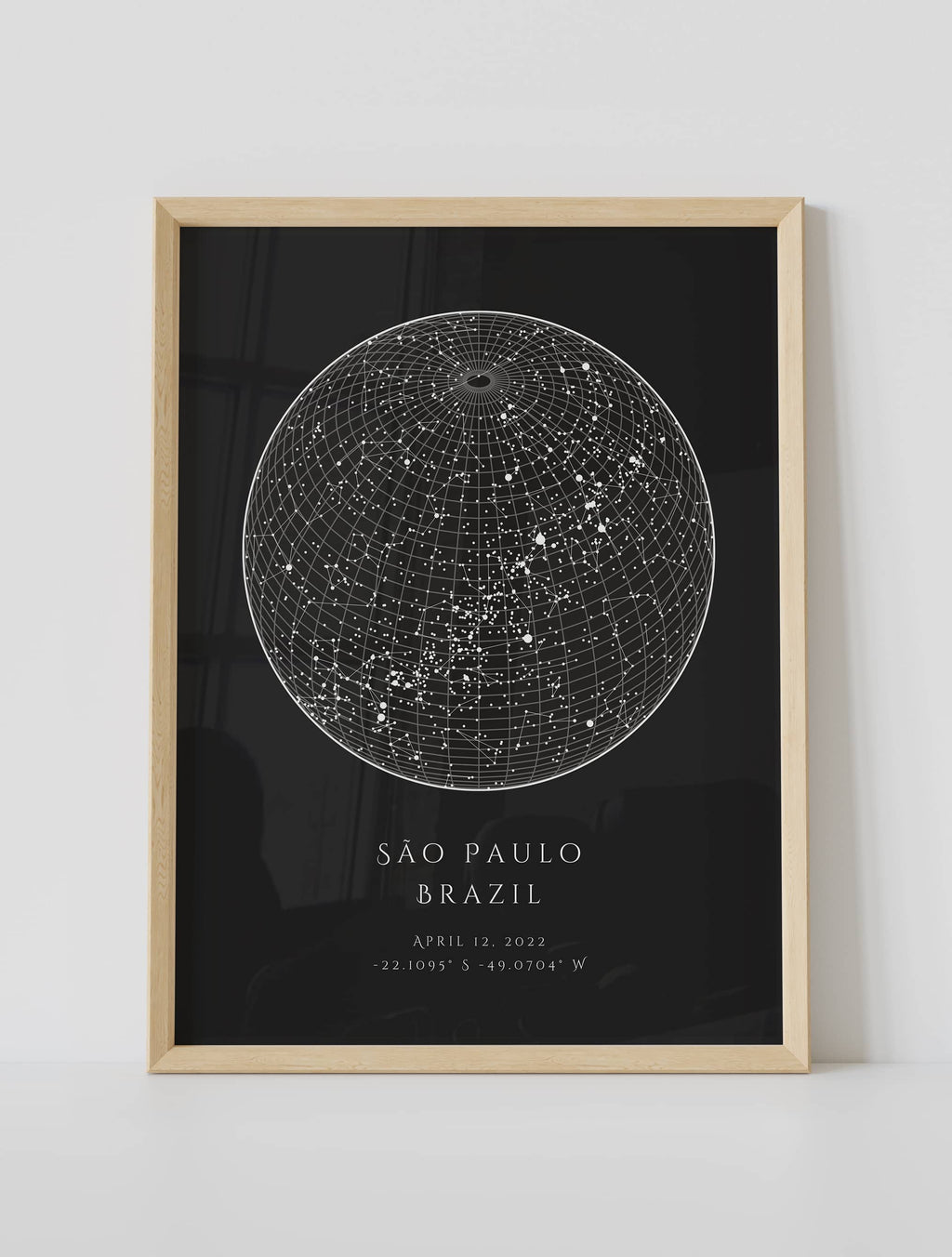 A framed custom star map poster featuring a specific date and location