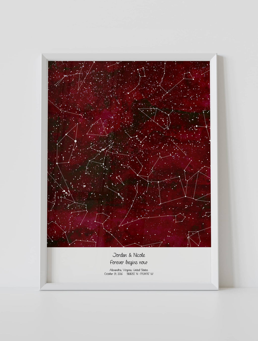 A framed custom star map poster featuring a specific date and location, customized with the quote "Forever begins here"