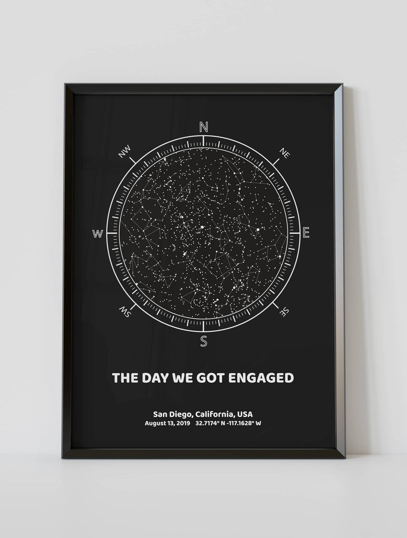 A framed custom star map poster featuring a specific date and location, customized with the quote "The day we got engaged"